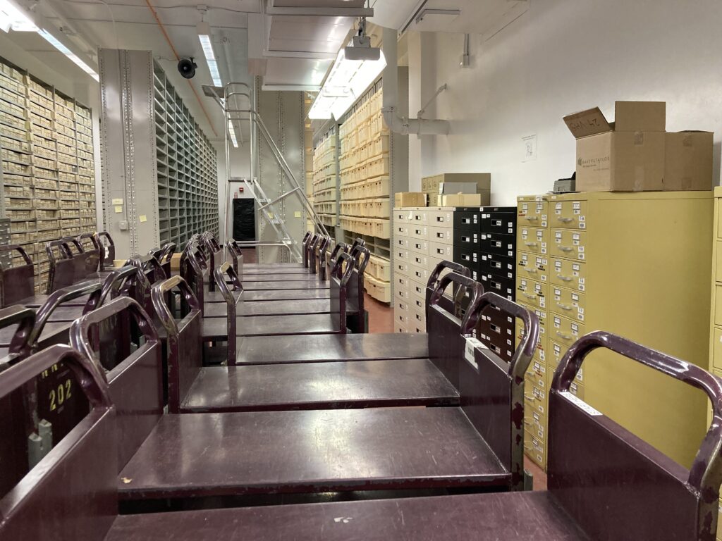 Line up of carts with file drawers along walls